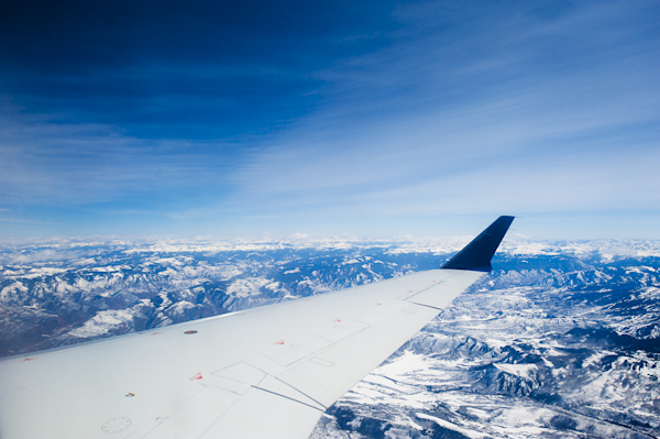 flying-over-snow-covered-mountain