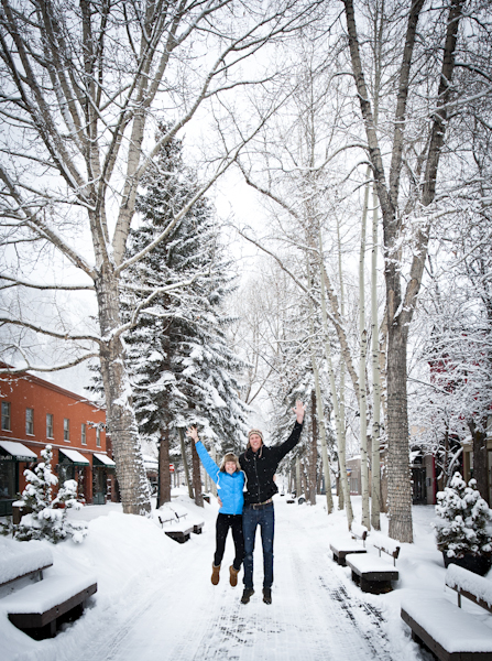 young-couple-jumping-snow