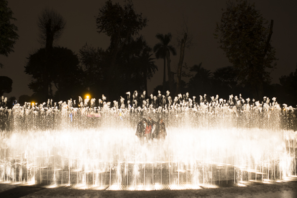 people playing in fountain